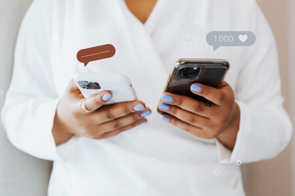 Woman holding two phones.
